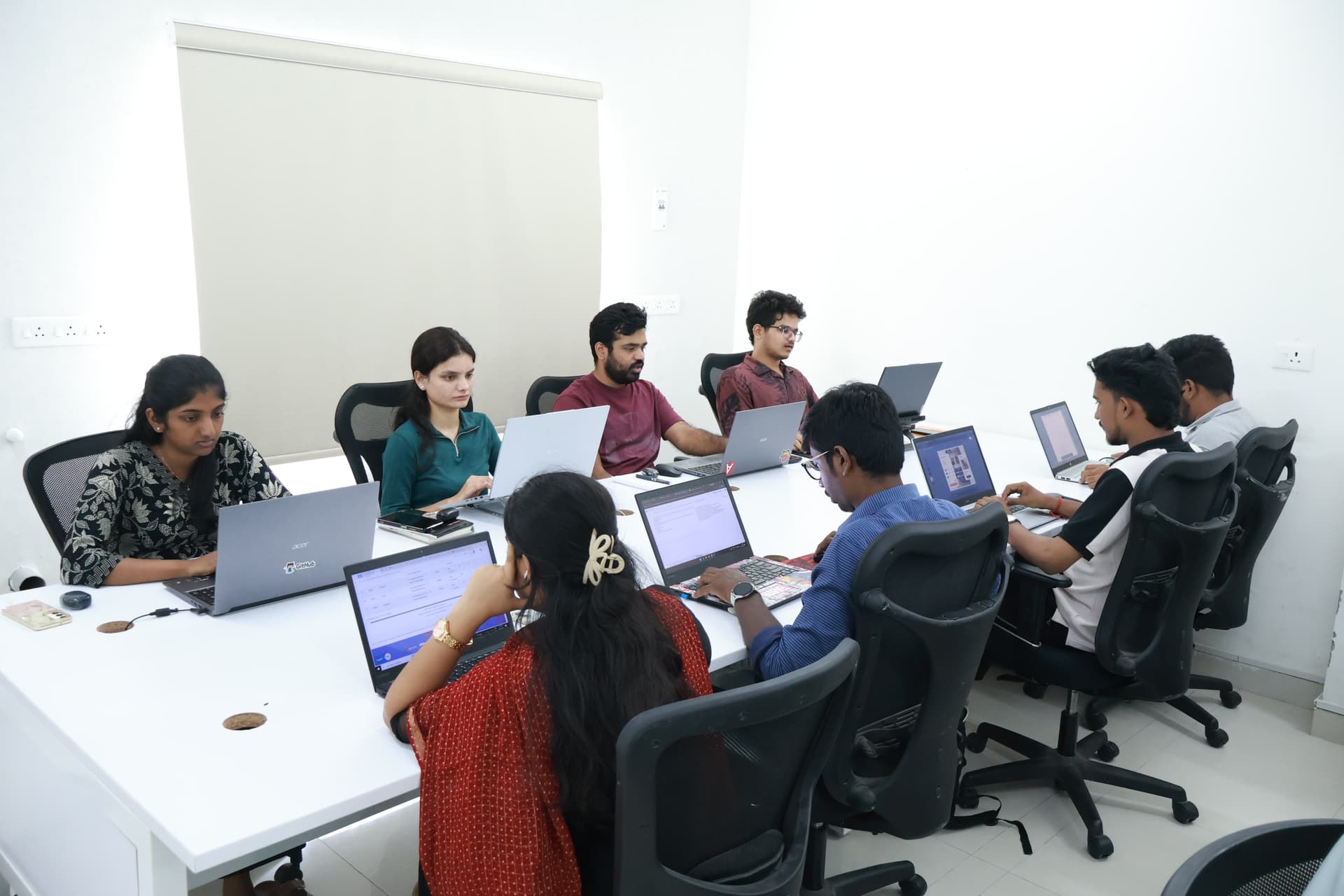 Students participating in a dynamic tech hackathon